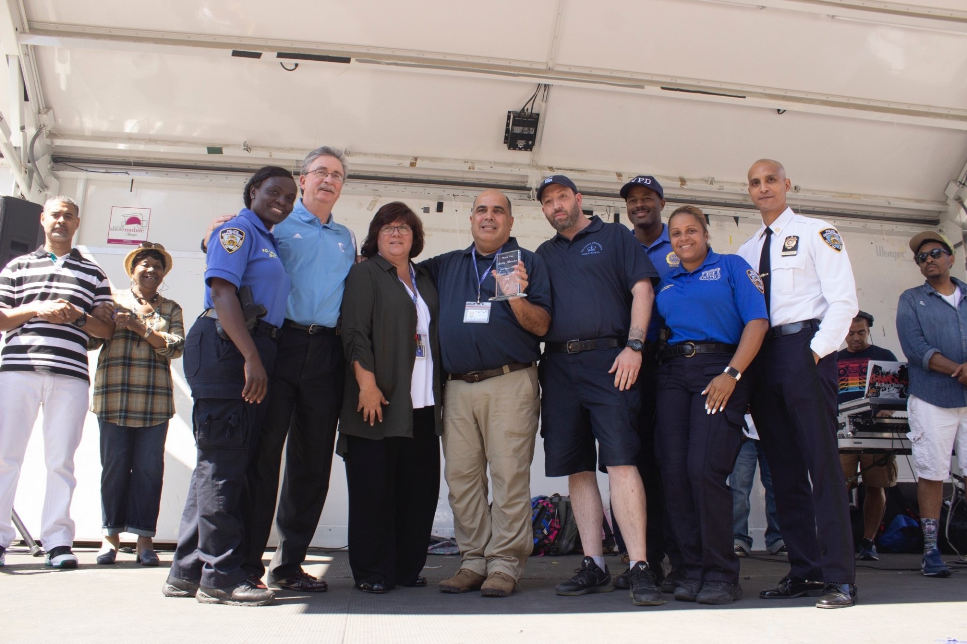 NYPD Community Officer Kathleen Clifford (left) honored Assistant Director of Crime Prevention Ricky Morales (center) for his years of partnership between Columbia and the community. NYPD Community Officer Kathleen Clifford (left) honored Assistant Director of Crime Prevention Ricky Morales (center) for his years of partnership between Columbia and the community.