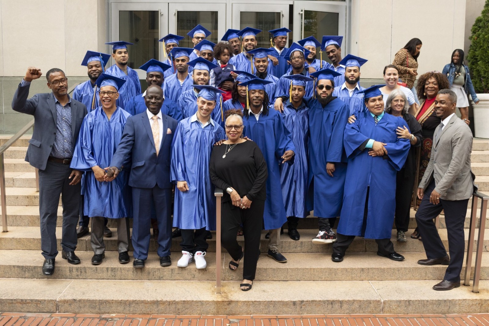 Graduates of the new pre-apprenticeship program pose outside Uris Hall