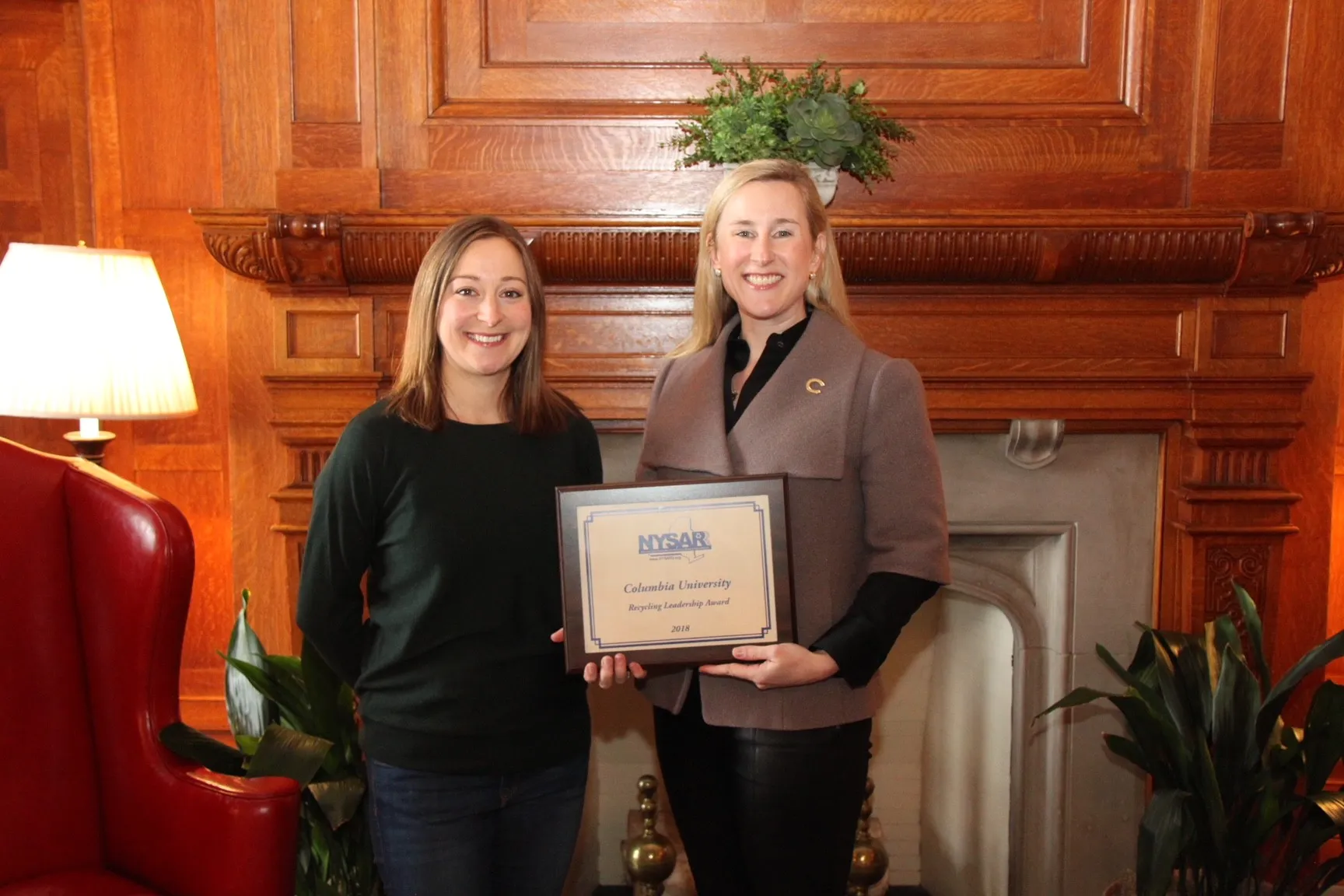 Jessica Prata, assistant vice president of Environmental Stewardship for Columbia University, (right) is presented with the 2018 Recycling Leadership Award-College or University by NYSAR3 President Kelli Timbrook.