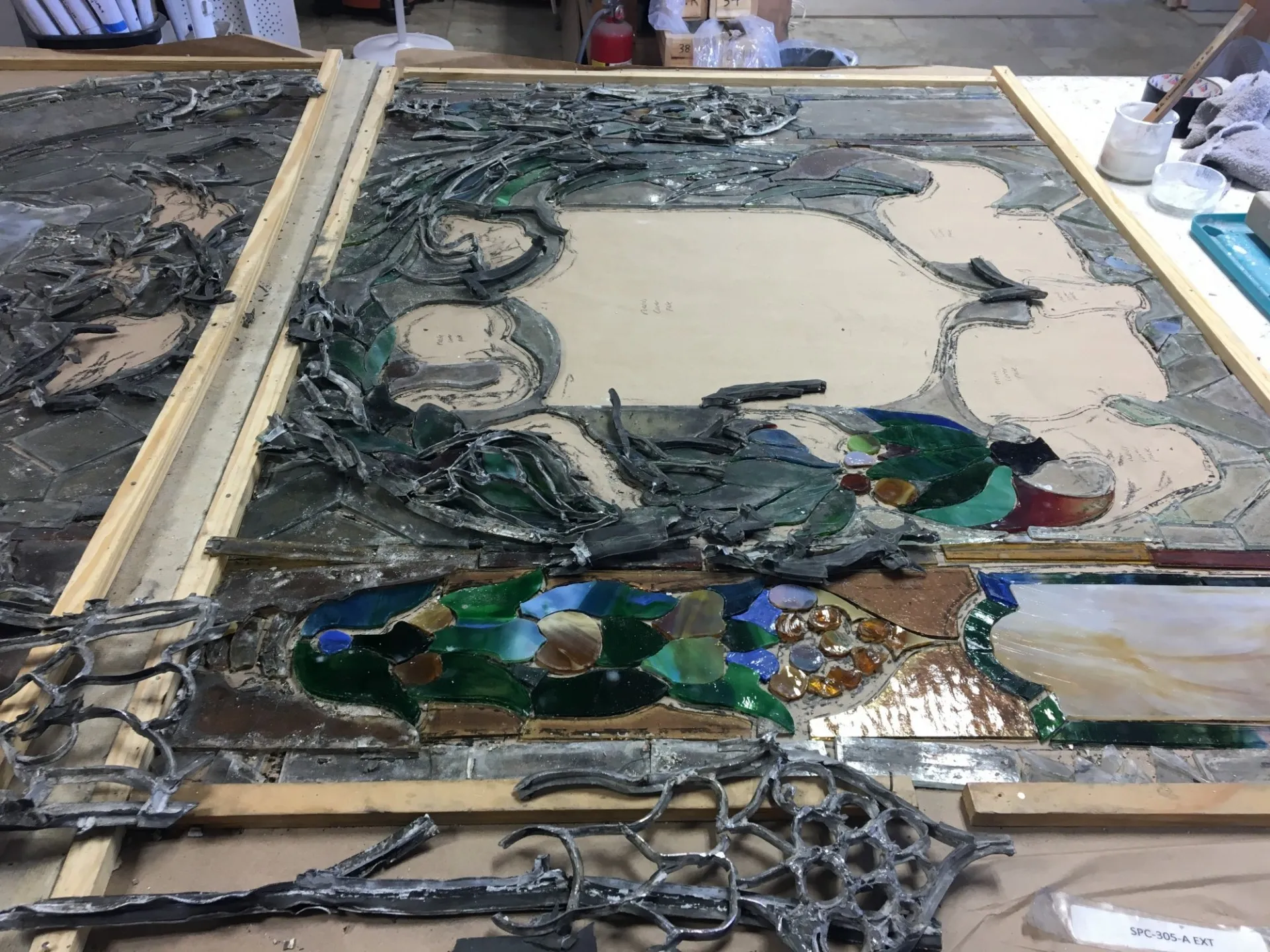 A portion of the stained glass windows being restored at a restoration studio
