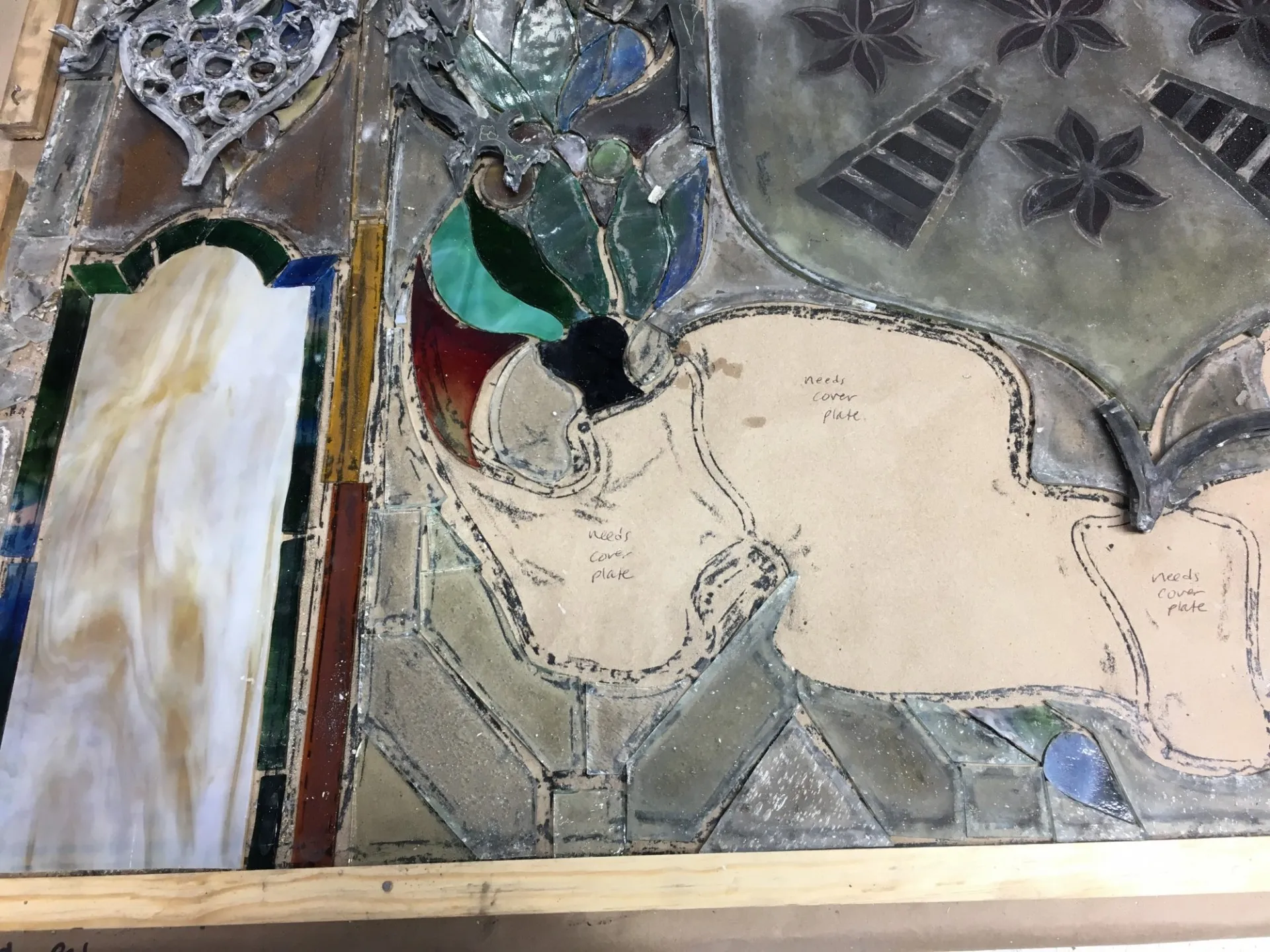 A portion of the stained glass windows being restored at a restoration studio