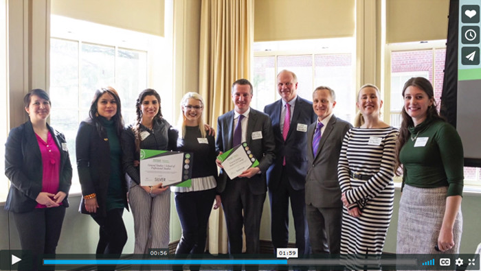 Columbia employees gather with Sustainable Leaders Network leadership with their Sustainable Workplace certificates